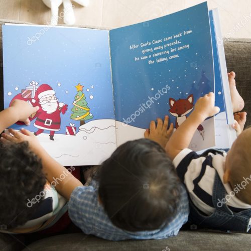 Young kids reading a Christmas story together