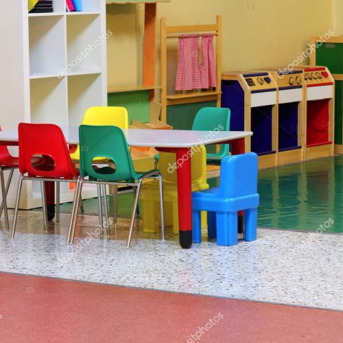 inside the kindergarten with small table and little chairs without children